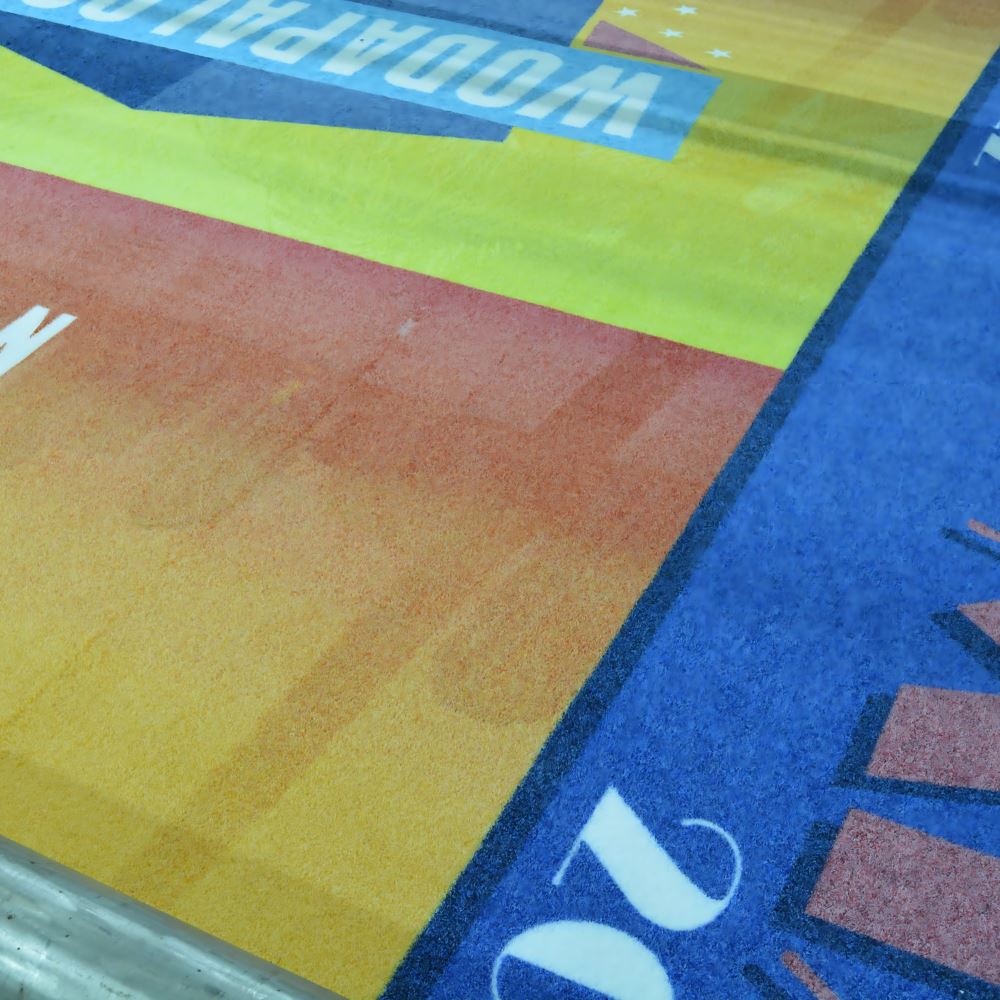 A close up image of artificial turf with a Miami design printed on it.